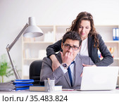 Sexual harassment concept with man and woman in office. Стоковое фото, фотограф Elnur / Фотобанк Лори