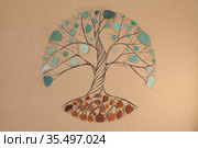 Transitory art arrangement - tree drawn on craft paper and and assortment of seaglass collected on beaches of Gran Canaria, representing seasonal change. Стоковая иллюстрация, иллюстратор Tamara Kulikova / Фотобанк Лори