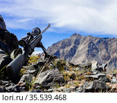 Rifle with a telescopic sight on bipod before shooting in the mountains. Стоковое фото, фотограф Олег Елагин / Фотобанк Лори