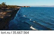 Озеро Байкал осенью. Песчаные дюны острова Ольхон. Вид с воздуха. Lake Baikal in autumn. Sand dunes of Olkhon Island. Aerial view. Стоковое видео, видеограф Евгений Романов / Фотобанк Лори
