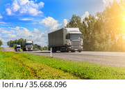 Truck convoy delivers goods on a country road. Стоковое фото, фотограф Юрий Бизгаймер / Фотобанк Лори