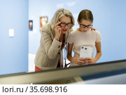 Woman and girl visiting museum. Стоковое фото, фотограф Яков Филимонов / Фотобанк Лори