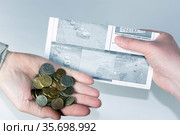 Russia, Samara, February 2021: men's hands transfer money to pay a fine for violation of traffic rules. Text in Russian: 1000 rubles, receive letters in electronic form, identification of the state registration plate, save yours, time is not refundable. Редакционное фото, фотограф Акиньшин Владимир / Фотобанк Лори