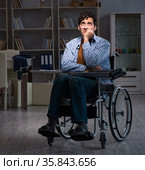 Man suffering from depression at wheelchair. Стоковое фото, фотограф Elnur / Фотобанк Лори