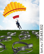 Businessman falling into trap on parachute. Стоковое фото, фотограф Elnur / Фотобанк Лори