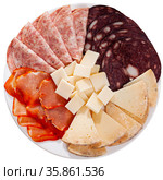 Slicing of smoked sausage, ham, dried pork carbonade and cheese. Стоковое фото, фотограф Яков Филимонов / Фотобанк Лори
