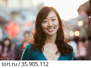 Portrait Of Smiling Mid Adult Woman In Houhai, Beijing. Стоковое фото, агентство Ingram Publishing / Фотобанк Лори