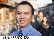 Portrait of young business man in Houhai, Beijing, China. Стоковое фото, агентство Ingram Publishing / Фотобанк Лори