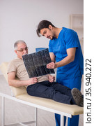 Old male patient visting young male doctor radilogist. Стоковое фото, фотограф Elnur / Фотобанк Лори