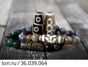 Tibetan Dzi natural beads - 9 eyes, Fortune, Big man. Стоковое фото, фотограф ElenArt / Фотобанк Лори