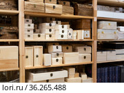 Decorative wooden jewelry storage caskets on shelves in store. Стоковое фото, фотограф Яков Филимонов / Фотобанк Лори