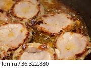 Frying marinated pork in copious quentities of oil in a pan. Стоковое фото, фотограф Tamara Kulikova / Фотобанк Лори