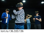 Boy child playfully poses in virtual reality glasses. Стоковое фото, фотограф Яков Филимонов / Фотобанк Лори