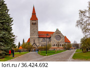 Medieval Tampere cathedral in Finland (Finnish Tampereen tuomiokirkko, Swedish Tammerfors domkyrka) is a church St. John. Famous landmark was built between 1902 and 1907 in national romanticism Style. Стоковое фото, фотограф Алексей Ширманов / Фотобанк Лори