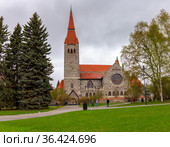 Medieval Tampere cathedral in Finland (Finnish Tampereen tuomiokirkko, Swedish Tammerfors domkyrka) is a church St. John. Famous landmark was built between 1902 and 1907 in national romanticism Style. Стоковое фото, фотограф Алексей Ширманов / Фотобанк Лори