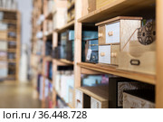 Decorative wooden jewelry storage caskets on shelves in store. Стоковое фото, фотограф Яков Филимонов / Фотобанк Лори