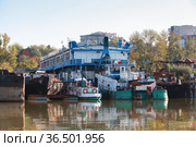 Ruse port view with old moored tugs and ships (2014 год). Стоковое фото, фотограф EugeneSergeev / Фотобанк Лори