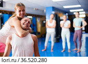 Young woman performing chokehold. Стоковое фото, фотограф Яков Филимонов / Фотобанк Лори