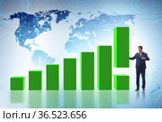 Businessman supporting economic growth on chart. Стоковое фото, фотограф Elnur / Фотобанк Лори