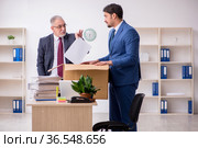 Two male employees in dismissal concept. Стоковое фото, фотограф Elnur / Фотобанк Лори