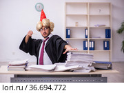 Funny young male employee magician and too much work in the office. Стоковое фото, фотограф Elnur / Фотобанк Лори
