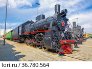 Russia, Verkhnyaya Pyshma, July 2021: Steam locomotives of the Ov and Eu series at the site of the Military Glory Museum of the Urals. Редакционное фото, фотограф Акиньшин Владимир / Фотобанк Лори
