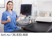 Young girl doctor holding ultrasound at cabinet for examination. Стоковое фото, фотограф Яков Филимонов / Фотобанк Лори