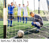 Goalkipper feeling sad about he didn't catch ball. Стоковое фото, фотограф Яков Филимонов / Фотобанк Лори