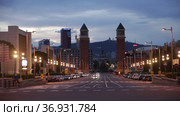 Picturesque cityscape in summer evening overlooking lighted avenue Avinguda de la Reina Maria Cristina with two Venetian Towers at junction with Placa dEspanya (2021 год). Редакционное видео, видеограф Яков Филимонов / Фотобанк Лори