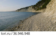 Закат на Черном море. Галечный пляж и скалистые берега. Sunset on the Black Sea. Pebble beach and rocky shores. Стоковое видео, видеограф Евгений Романов / Фотобанк Лори