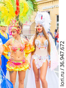 Russia, Samara, July 2019: processions of beautiful dressed up girls on Kuibyshev street at the carnival dedicated to the World Cup. Редакционное фото, фотограф Акиньшин Владимир / Фотобанк Лори