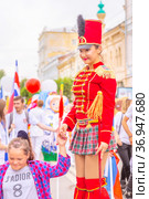 Russia, Samara, July 2019: a beautiful girl in a hussar costume on Kuibyshev street at the carnival dedicated to the World Cup. Редакционное фото, фотограф Акиньшин Владимир / Фотобанк Лори