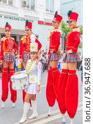 Russia, Samara, July 2019: a beautiful girl in a hussar costume on Kuibyshev street at the carnival dedicated to the World Cup. Редакционное фото, фотограф Акиньшин Владимир / Фотобанк Лори