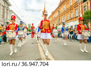 Russia, Samara, July 2019: a beautiful girl in a hussar costume on Kuibyshev street at the carnival dedicated to the World Cup. Редакционное фото, фотограф Акиньшин Владимир / Фотобанк Лори