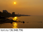 Forest fires smog enveloped Onego lakeside of Petrozavodsk city in summer day. Стоковое фото, фотограф Sergei Gorin / Фотобанк Лори