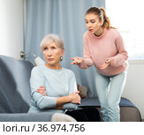 Daughter quarreling with her senior mother at home. Стоковое фото, фотограф Яков Филимонов / Фотобанк Лори