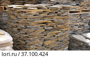 Pallets with stack of natural stone blocks lying at warehouse of building materials. Стоковое видео, видеограф Яков Филимонов / Фотобанк Лори