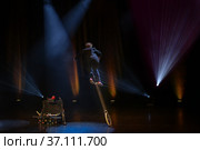 Juggler clown in the circus arena on unicycle. Стоковое фото, фотограф Irina Kuchugurina/Gaudy / Фотобанк Лори