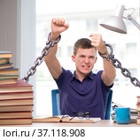 Young student forced to study tied. Стоковое фото, фотограф Elnur / Фотобанк Лори