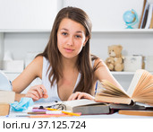 Female student is doing homework. Стоковое фото, фотограф Яков Филимонов / Фотобанк Лори