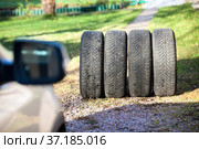 Four winter and snow wheels are for changing before snowfall in autumn season. Стоковое фото, фотограф Кекяляйнен Андрей / Фотобанк Лори