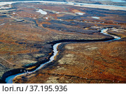 Summer nature landscape from above. Mountain range aerial view. river bank in the morning in the tundra. Taimyr Peninsula, Russia. Norilsk. Редакционное фото, фотограф Александр Сергеевич / Фотобанк Лори