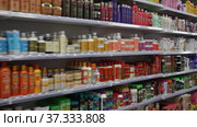 Various of haircare cosmetics and wigs for sale on shelves of specialty cosmetic shop (2020 год). Редакционное видео, видеограф Яков Филимонов / Фотобанк Лори