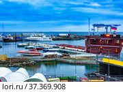 Seaport of small vessels in winter in cloudy weather in the evening. Стоковое фото, фотограф Владимир Ушаров / Фотобанк Лори