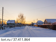 Sunset over the village in winter in Russia. Стоковое фото, фотограф Дмитрий Тищенко / Фотобанк Лори