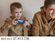 Kids with joysticks. Стоковое фото, фотограф Kozub Vasyl / Фотобанк Лори