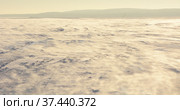Frozen Onego lake with snow dust from the strong wind. Стоковое фото, фотограф Алексей Кокоулин / Фотобанк Лори