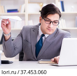 Businessman with paper airplane in office. Стоковое фото, фотограф Elnur / Фотобанк Лори