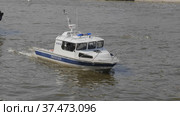 MOSCOW - MAY 7: Boat police of Russia floating on the Moscow river on May 7, 2017 in Moscow, Russia. Стоковое фото, фотограф Фотограф / Фотобанк Лори