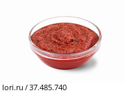 Ketchup in a sauce bowl on a white background. Стоковое фото, фотограф Марина Володько / Фотобанк Лори